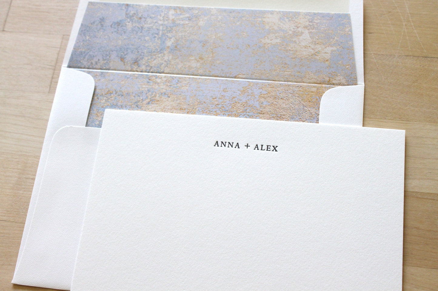 custom letterpress wedding stationery with patina envelope liner